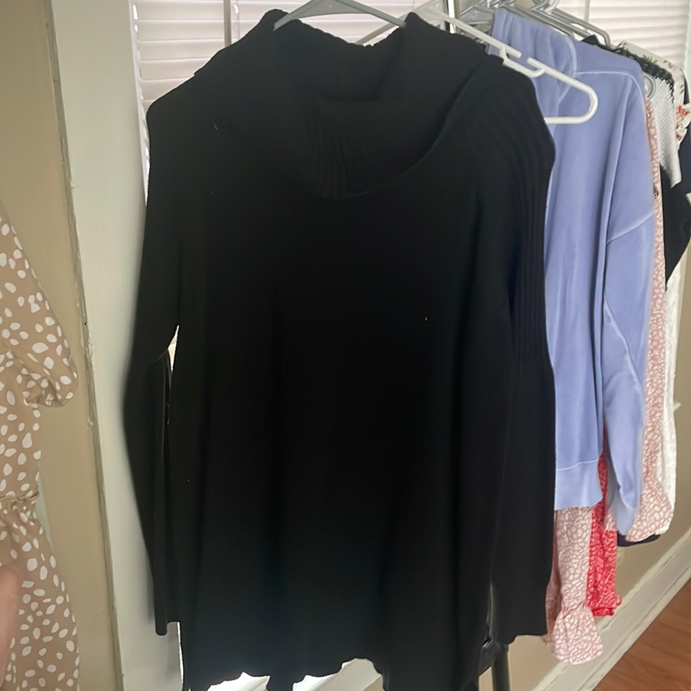 Black turtle neck shirt.